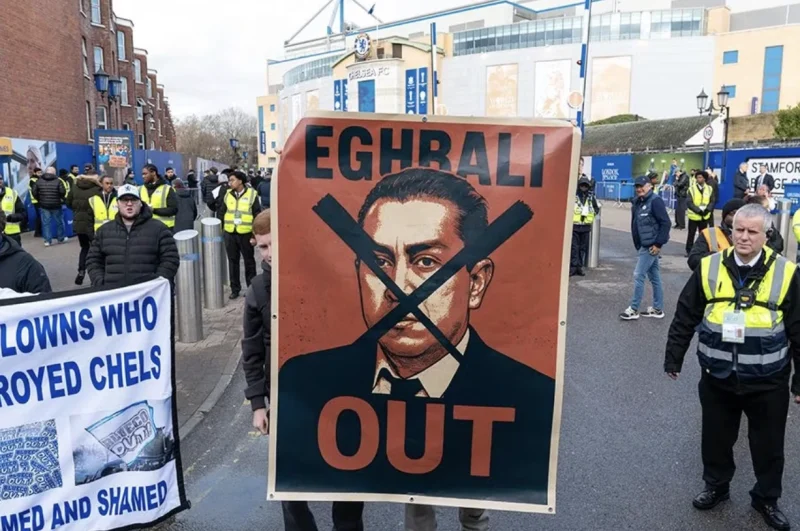 Chelsea Fans with an Anti Eghbali Poster Outside Stamford Bridge