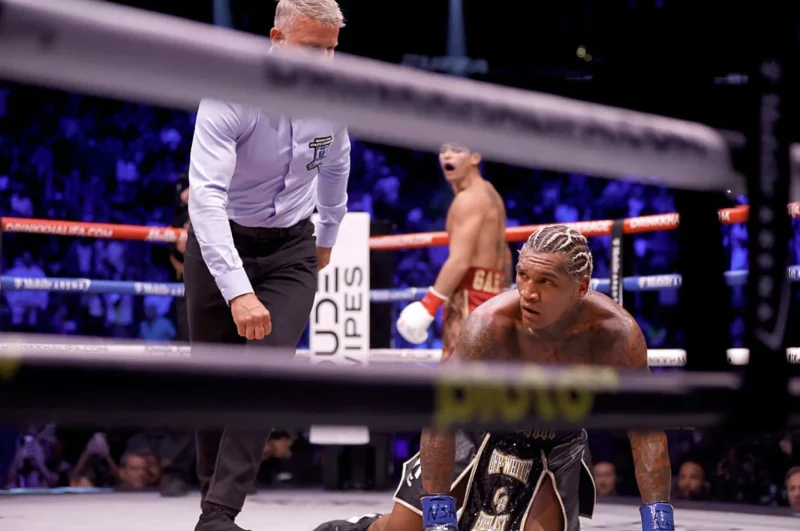Conor Benn on the Canvas After a Knockdown with Ryan Garcia Behind
