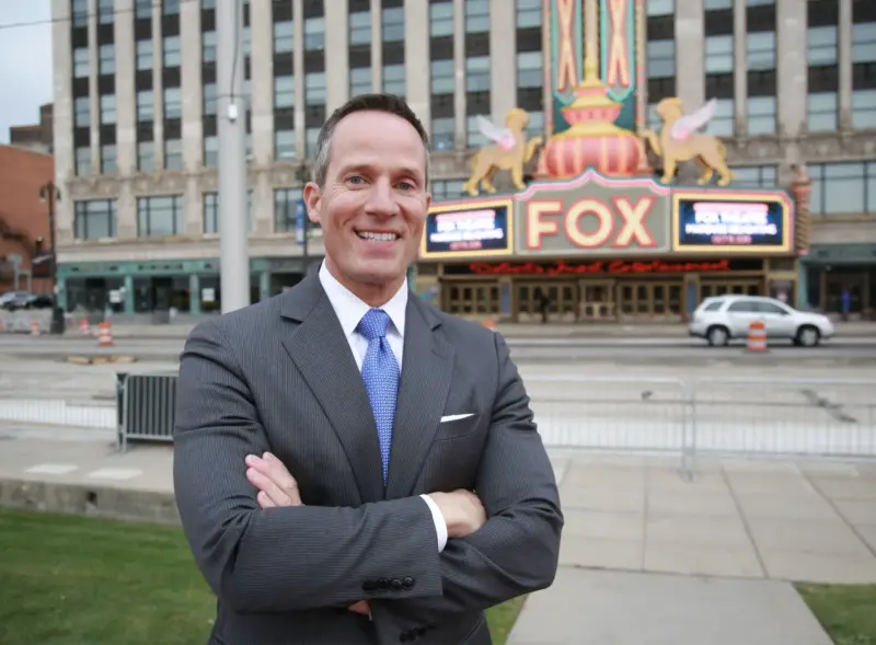 A Man in a Suit in Front of the Fox Theatre in Detroit