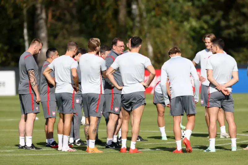 The Poland National Team Gathers in a Huddle with the Coach at Training